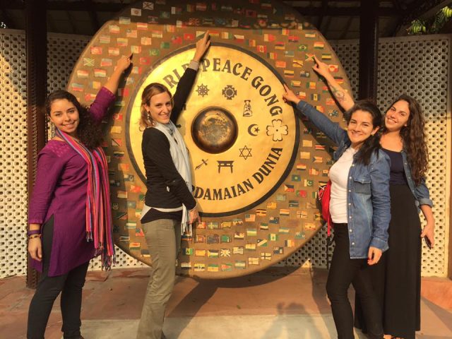 Students standing near the World Peace Gong at New Delhi