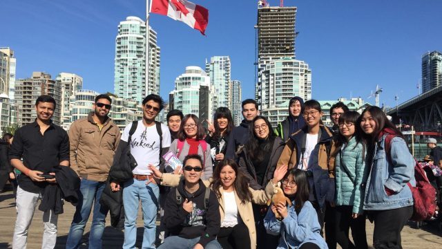 A group of Douglas College international students spending time
together outdoors in Vancouver, British Columbia on a sunny day.