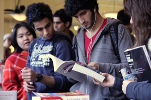 Students at the booksale table Students at the booksale table