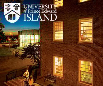 An exterior view of the main building on the campus of the University of Prince Edward Island in the nighttime.