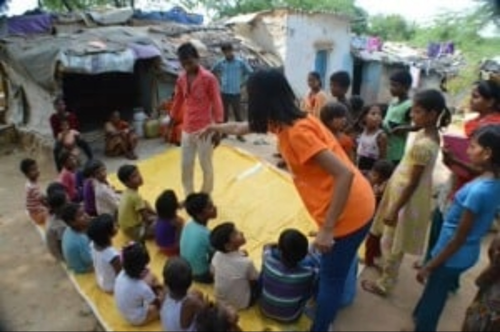 Shim Duidang gets the children to sit in a queue new delhi