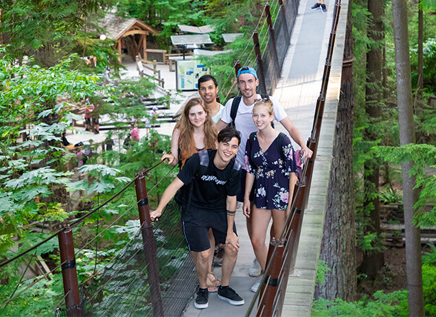 Group of international students from ILSC Vancouver explore Capilano Suspension Bridge outside of their English Study
