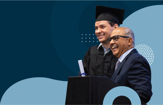 Study Business, Hospitality, Digital Marketing in Canada or Australia - Student wearing graduation cap and gown receives Diploma standing with Teacher