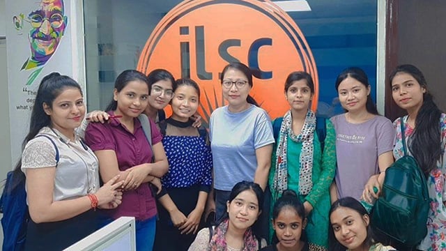 A group photo of ILSC New Delhi Learn to Earn program participants and their teacher