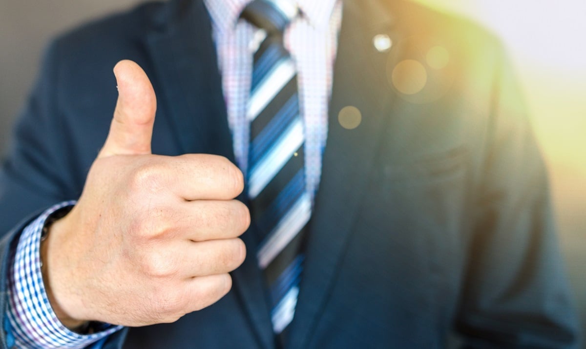 A person with their thumb up