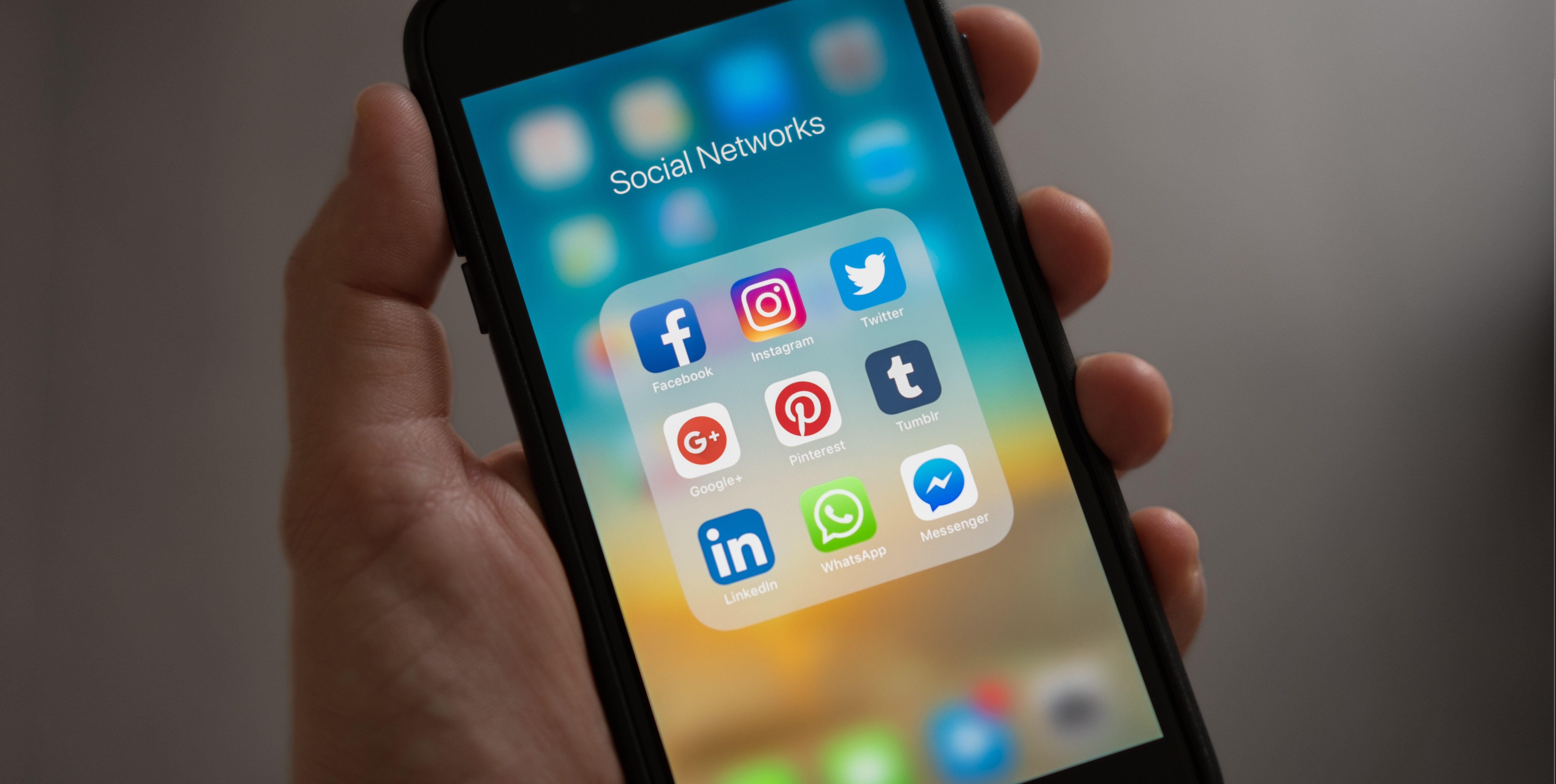 Hand holding a smartphone showing a 