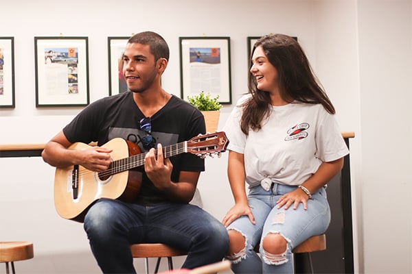 English Students in Brisbane play guitar and sing