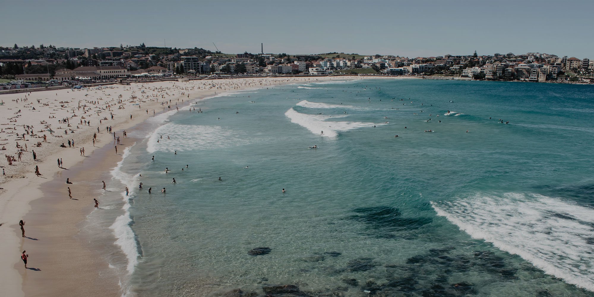 Crowds on Bondi beach in Sydney Australia, a great city to learn English