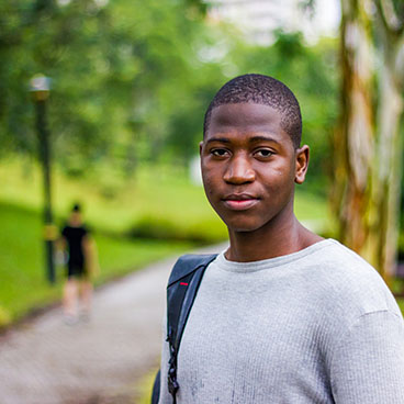 ilsc-humanitarian-scholarship-for-refugees-male-african-student-in-park
