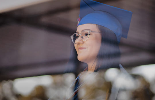 Articulation programs Australia - female student wearing blue graduation cap